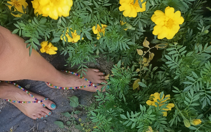 Handmade barefoot jewelry styled outdoors with flowers