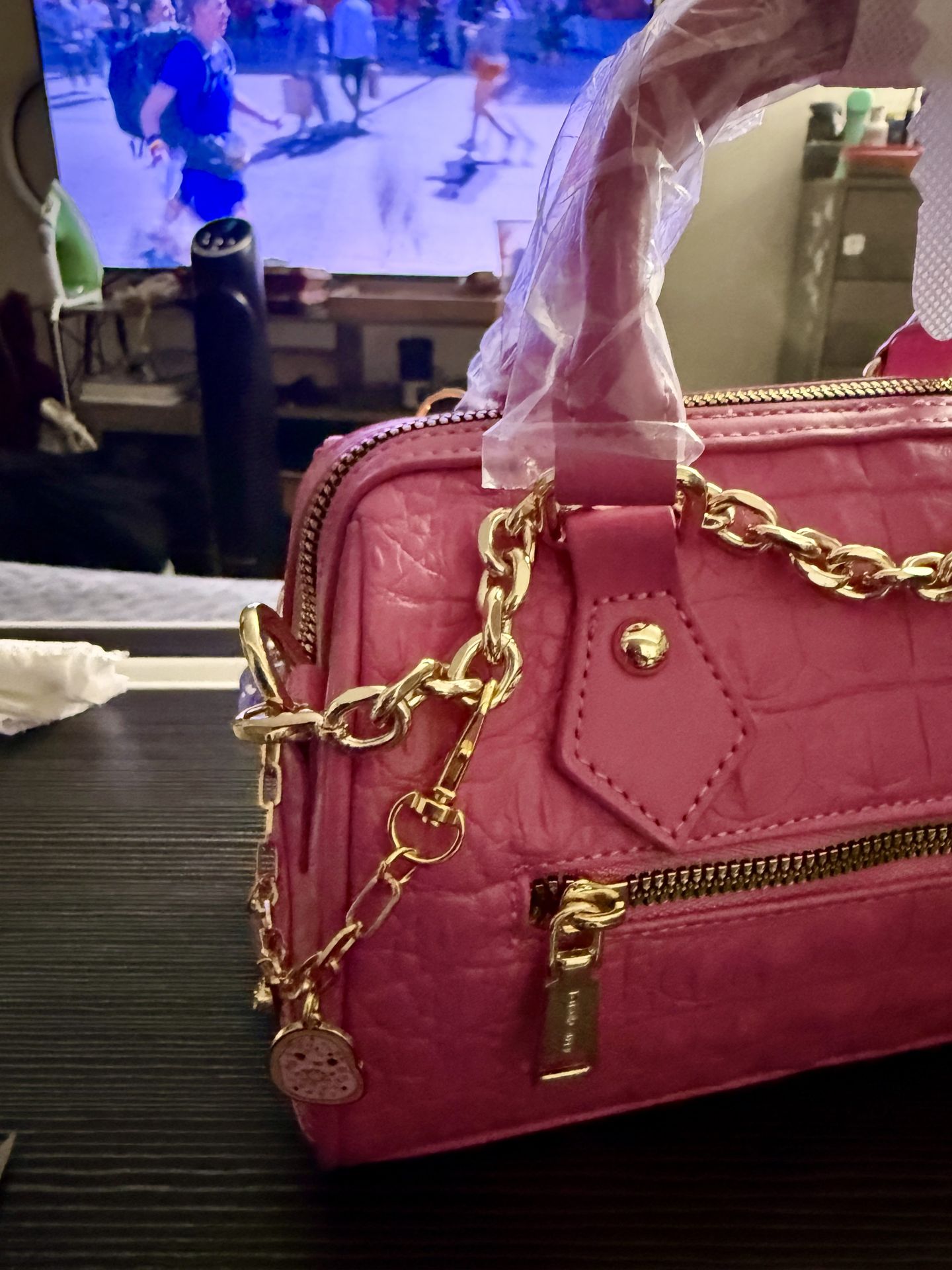 Back view pink Tote &amp; Carry handbag decorated with gold chain and handmade charms