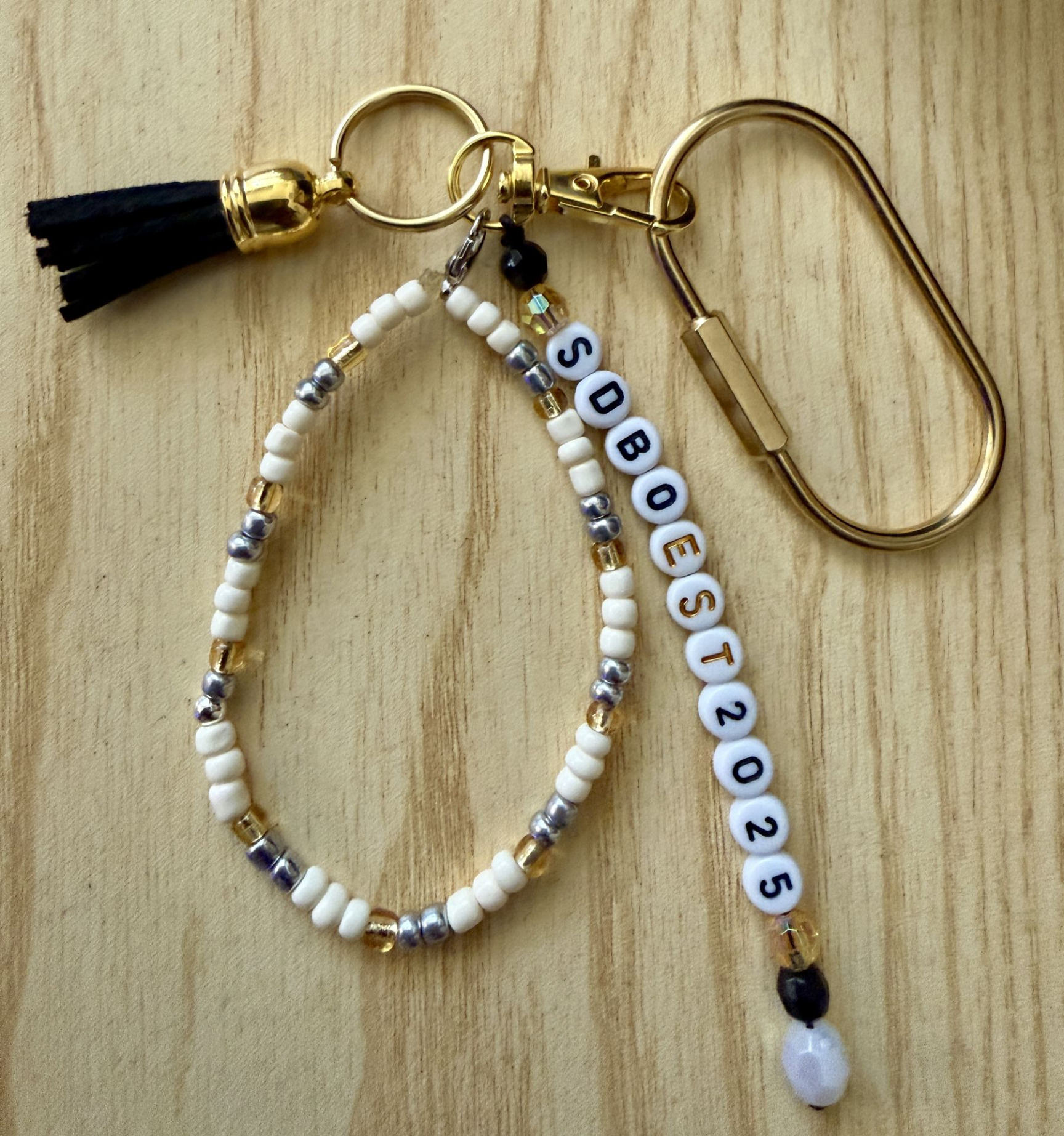 Handmade gold, cream, and silver beaded keychain charm