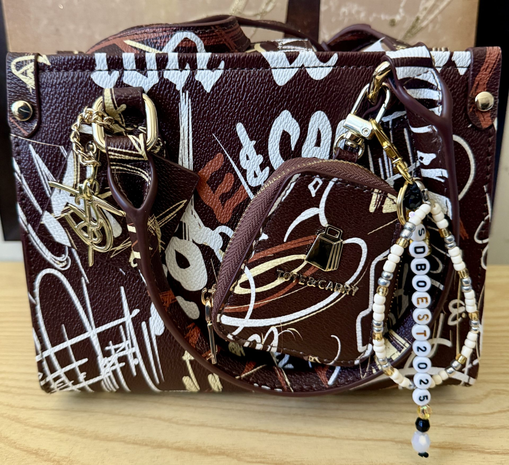 Tote &amp; Carry handbag with handmade decorative keychains and beaded bag charm collection
